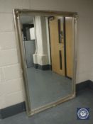 An ornate silvered mirror,