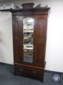 A Victorian mahogany mirror door wardrobe
