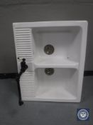 A Belfast style twin sink with taps