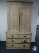 A Victorian pine double door cupboard on associated base