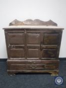 An antique pine mule chest fitted a drawer