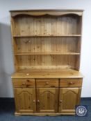A pine triple door kitchen dresser