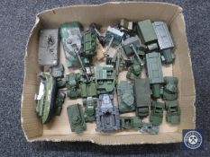 A box of mid 20th century plastic and die cast military vehicles by Dinky and Matchbox