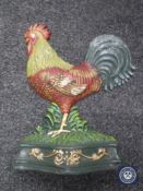 A cast metal cockerel door stop