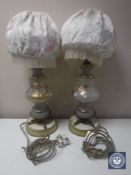 A pair of Victorian glass and metal table lamps with shades and hand painted decoration