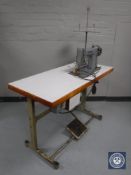 A Singer 188 KL industrial sewing machine in table