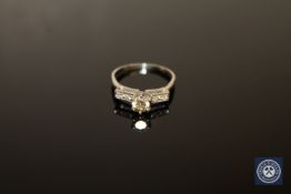 A diamond solitaire ring,