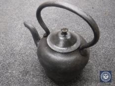 A cast metal kettle