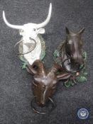 Three cast metal animal heads - a bull,