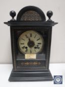 A late 19th century gilded ebonised bracket clock with brass and enamelled dial