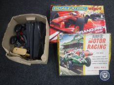 A boxed Scalextric Grand Prix set, a box of Scalextric track and accessories,