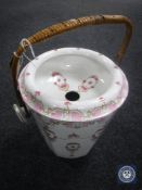 A 19th century Dresden china wicker handled slop pail