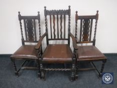 An oak barley twist carver armchair together with a pair of oak barley twist dining chairs