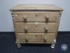 A Victorian pine three drawer chest