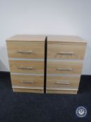 A pair of three drawer bedside chests