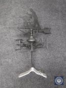 A cast metal Blacksmith weather vane