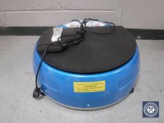 A Vibra Power disc exercise machine with remote