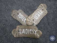 Three cast metal Art Deco style plaques