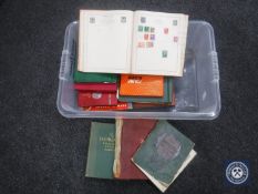 A box of fourteen mid 20th century stamp albums and stamps