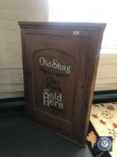 A 19th century pine corner cupboard bearing 