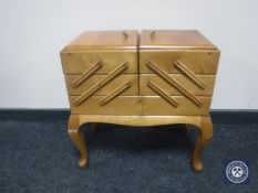 A mid 20th century concertina sewing box