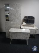 A three-piece mid 20th century melamine bedroom suite
