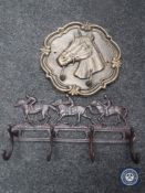 Two cast metal coat racks