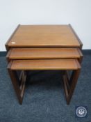 A nest of three teak G-Plan tables