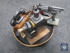 A large wire mesh sieve, vintage projector,