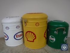 A nest of three storage stools bearing petroleum advertising