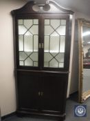 A Georgian mahogany corner cabinet,