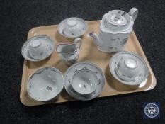 A Newhall porcelain teapot and cover, circa 1790, of commode form, puce mark to underside,