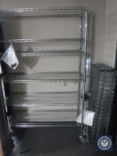 Two sets of metal six tier portable shelving