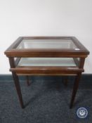 A mahogany curio table