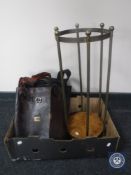 A cylindrical brass stick stand with four assorted leather satchels