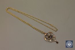 An Edwardian 9ct gold garnet and seed pearl brooch,