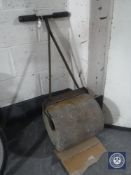 An antique garden roller