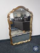 An ornate gilt framed mirror