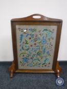 An oak tapestry fire screen