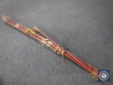 A set of vintage Hagan Goldstar skis and poles