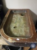 A salt glazed stone trough