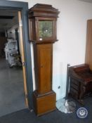 A stained pine longcase clock with brass dial signed Ralph Weston,
