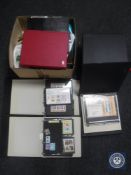 Two boxes of twelve albums of first day covers and a large quantity of first day covers and loose