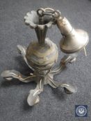 A heavy brass six way light fitting