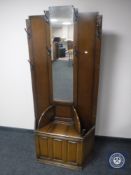 A 20th century oak mirrored hall stand