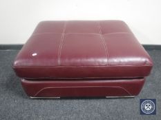 A Burgundy leather footstool