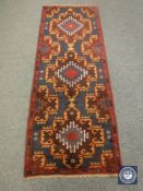 A Baluchi runner 203 cm x 76 cm