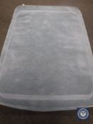 A hand tufted plain loop cut light blue rug, 160 cm x 230 cm,