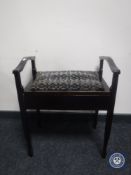 An Edwardian mahogany storage piano stool