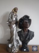 A chalk bust of a boy and a chalk figure of a lady